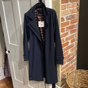 Beautiful navy rain/Trench coat. A timeless classic look!